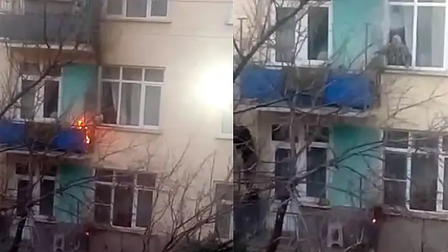 Balkonunda çıkan yangını pencereden su döküp söndürdü