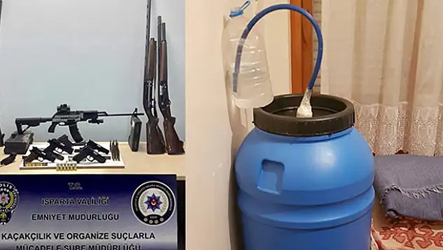 Isparta'da sahte içki üretimi yapılan evden cephanelik çıktı