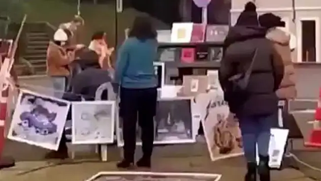 Kabe fotoğrafını yere seren 2 kişi tutuklandı