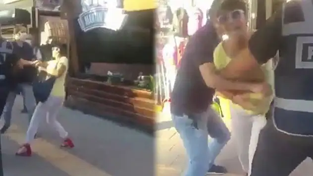Maske takmamak için polise direnen kadına hemcinsinden görülmemiş tepki...