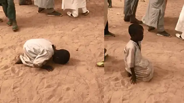 Türk ekip görüntüledi! Çad'da bir çocuğun kum üzerinde namaz kıldığı o anlar
