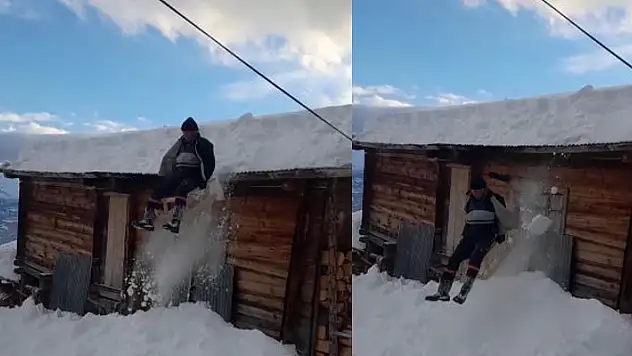 Yolda kaymaktan sıkılan dede ve torunu soluğu evin çatısında aldı
